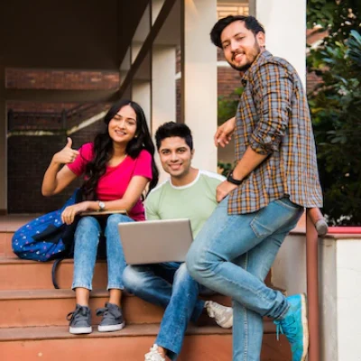 young-asian-indian-college-students-reading-books-studying-laptop-preparing-exam-working-group-project-while-sitting-grass-staircase-steps-college-campus_466689-7693